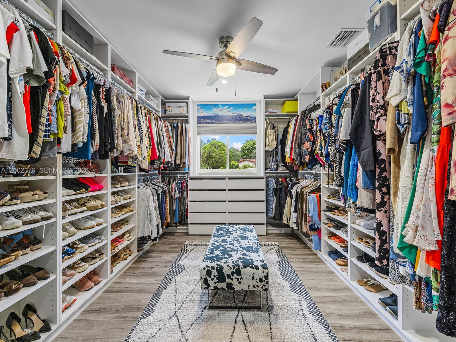 7495 Southwest 73rd Terrace Miami, FL 33143 - Photo 25 of 33 a view of walk in closet with clothes and shoes