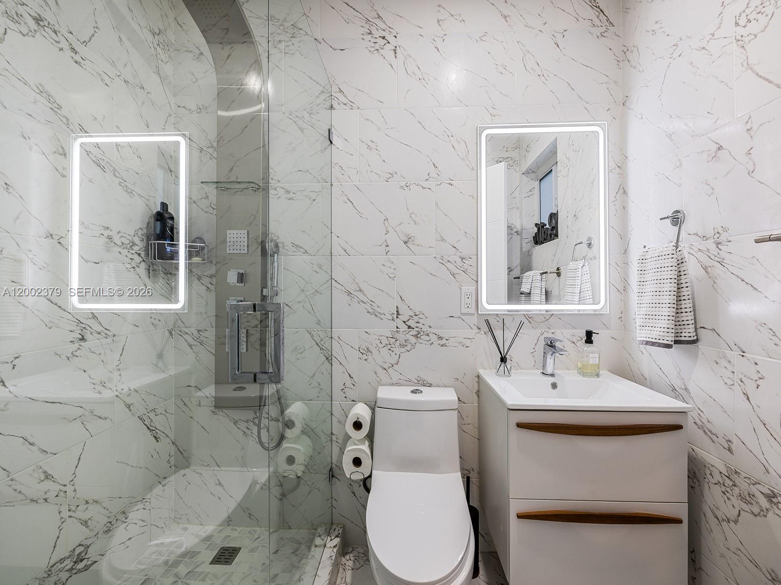 7495 Southwest 73rd Terrace Miami, FL 33143 - Photo 29 of 33 a bathroom with a sink toilet and shower