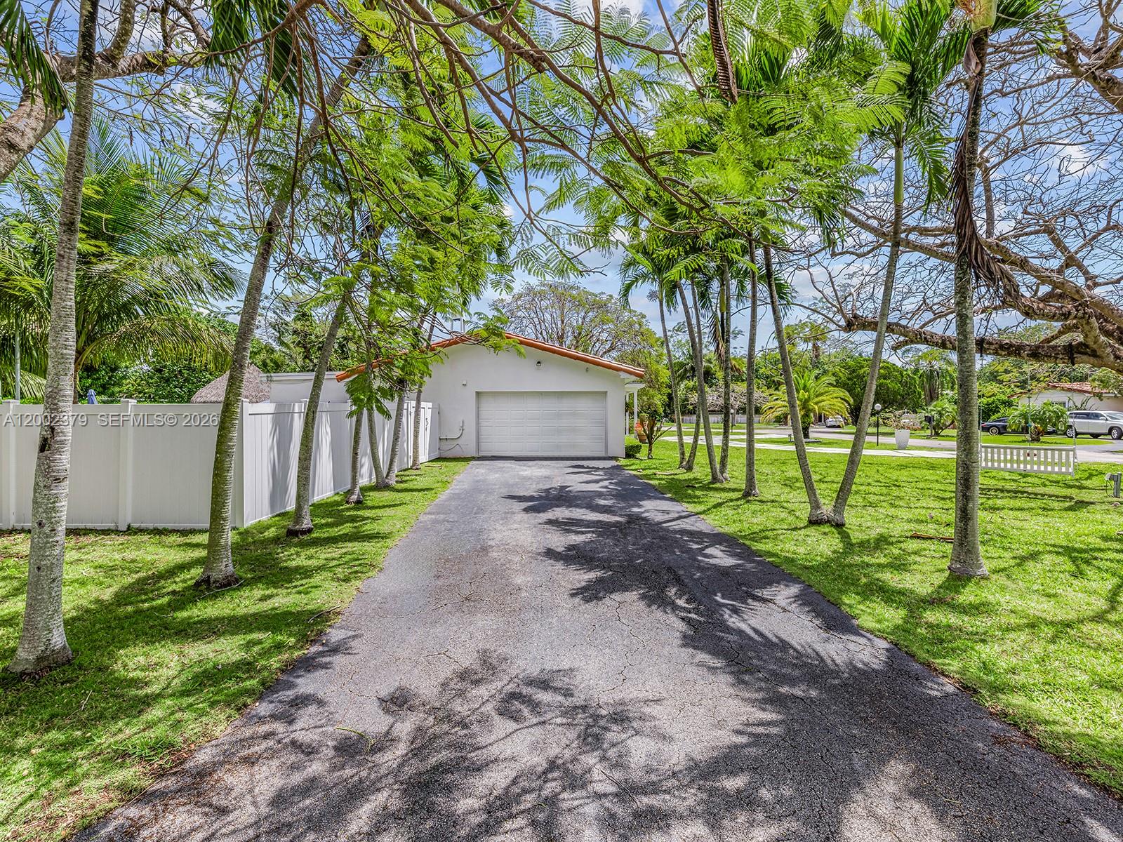 7495 Southwest 73rd Terrace Miami, FL 33143 - Photo 31 of 33 a view of a house with backyard and a tree
