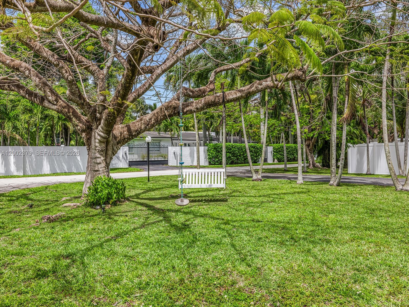 7495 Southwest 73rd Terrace Miami, FL 33143 - Photo 32 of 33 front view of a house with a yard