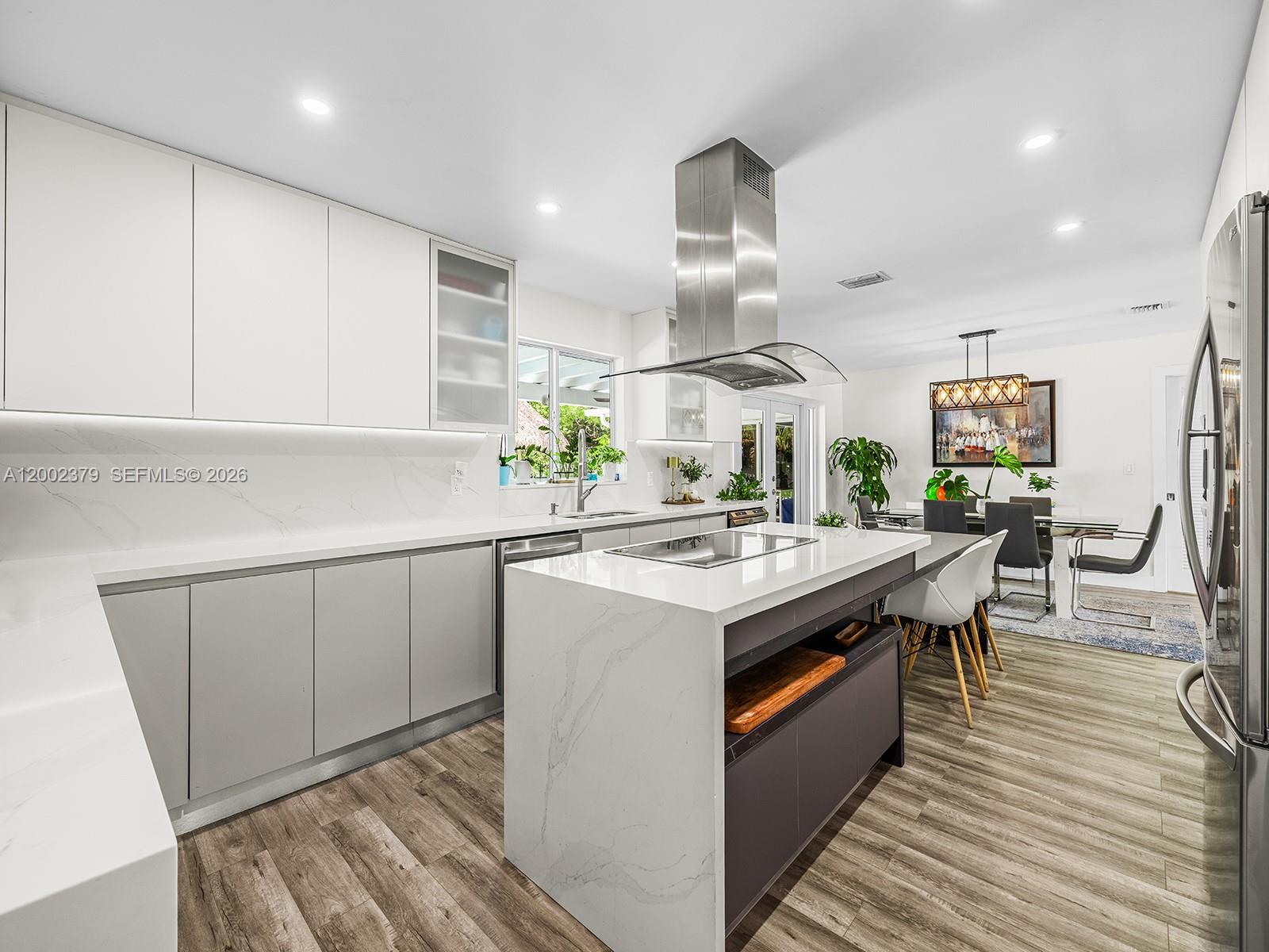 7495 Southwest 73rd Terrace Miami, FL 33143 - Photo 6 of 33 a kitchen with a sink cabinets and wooden floor