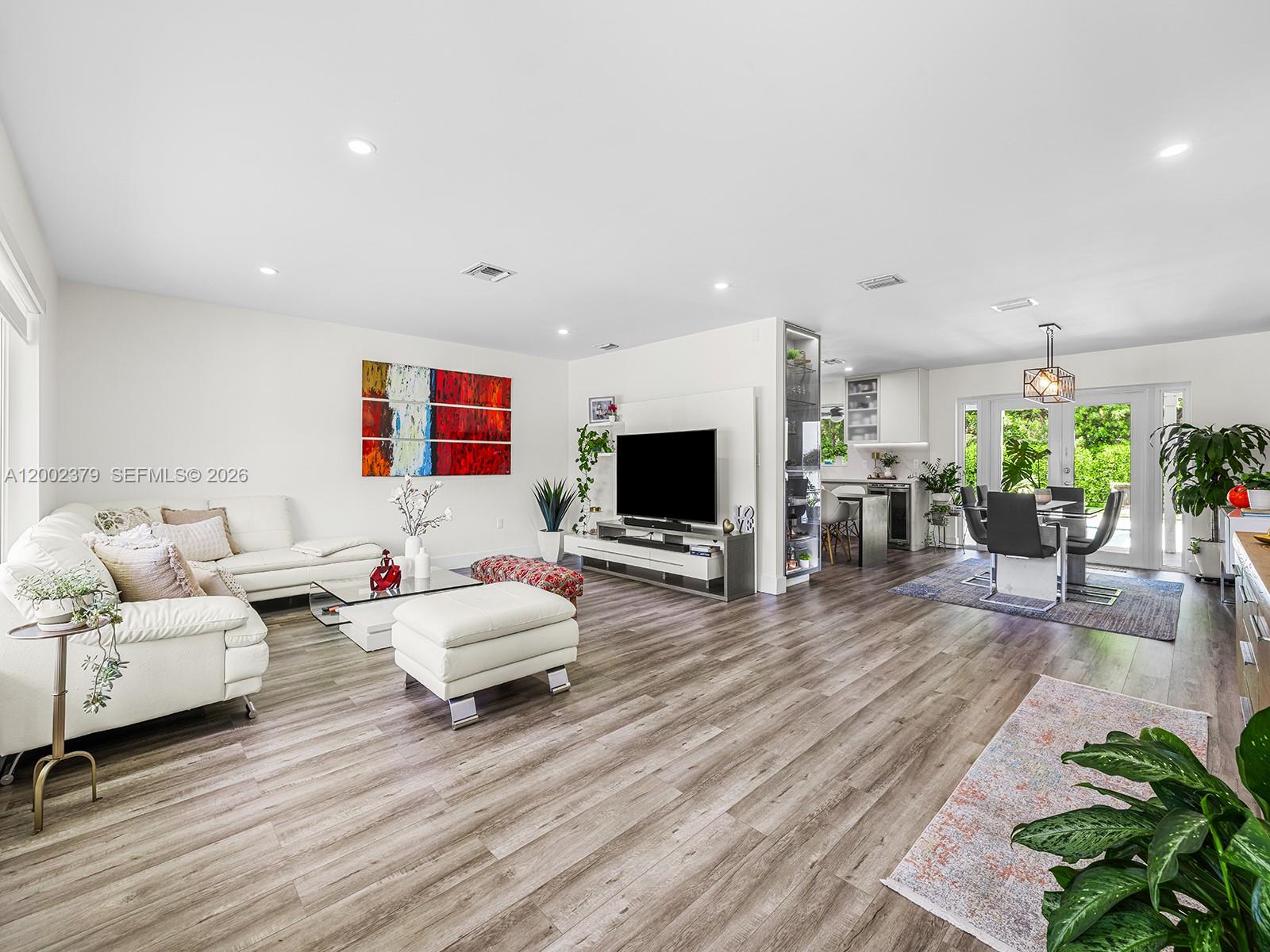 7495 Southwest 73rd Terrace Miami, FL 33143 - Photo 10 of 33 a living room with furniture and a flat screen tv