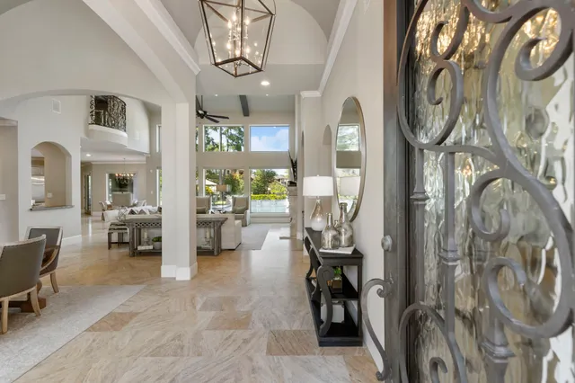 a view of a livingroom with furniture and a chandelier