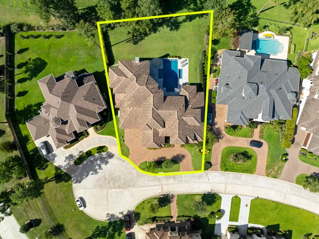 an aerial view of houses with outdoor space