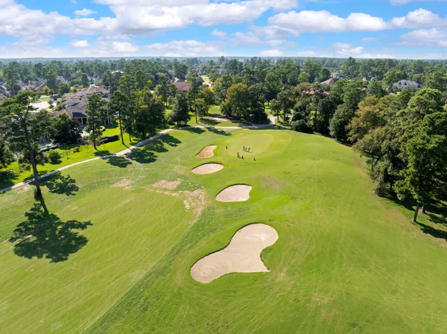 a view of a golf course with a swimming pool