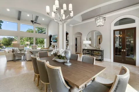 a view of a dining room with furniture window and outside view
