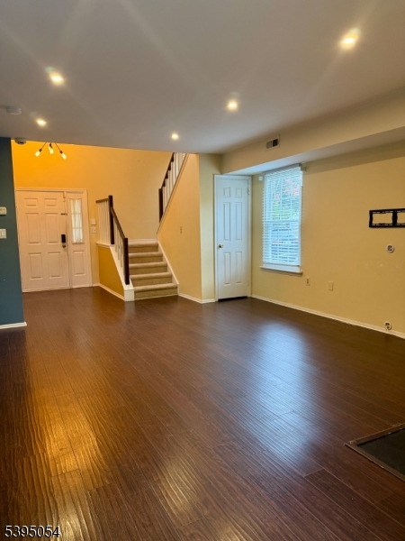 92 Winchester Way Somerset, NJ 08873 - Photo 3 of 19 an empty room with wooden floor and windows