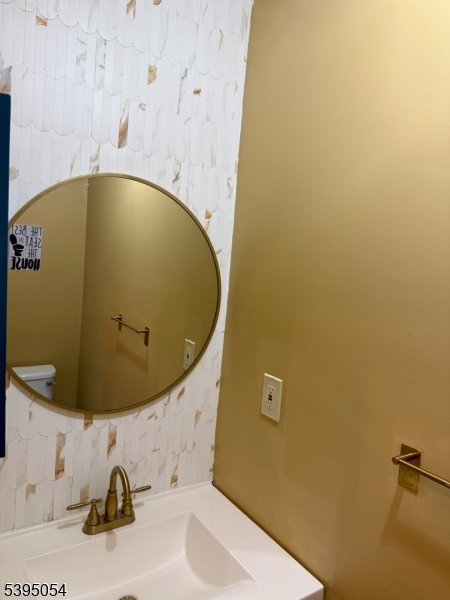 92 Winchester Way Somerset, NJ 08873 - Photo 9 of 19 a bathroom with a sink and mirror