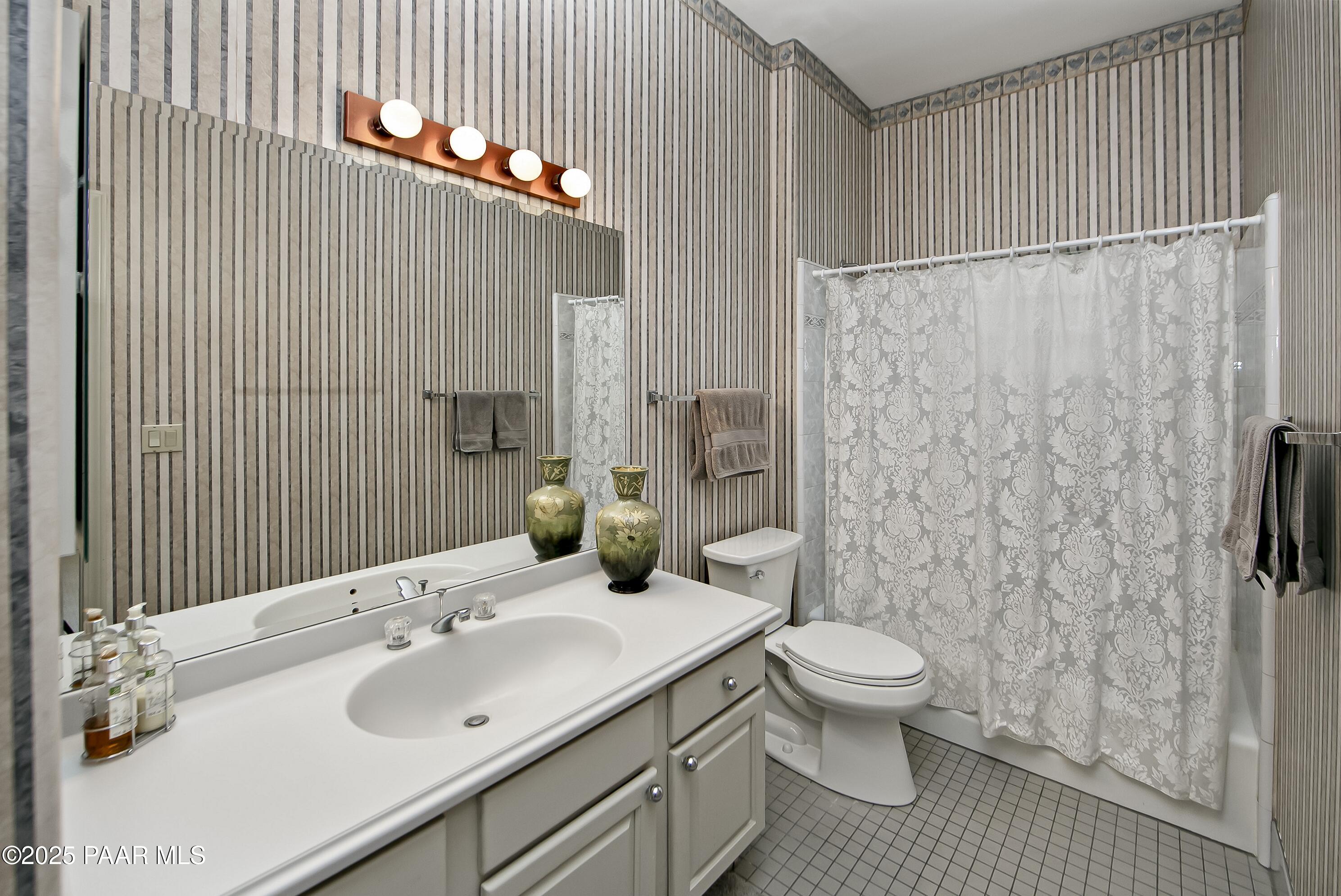 1905 Timber Point West Prescott, AZ 86303 - Photo 15 of 27 a bathroom with a sink a toilet and shower