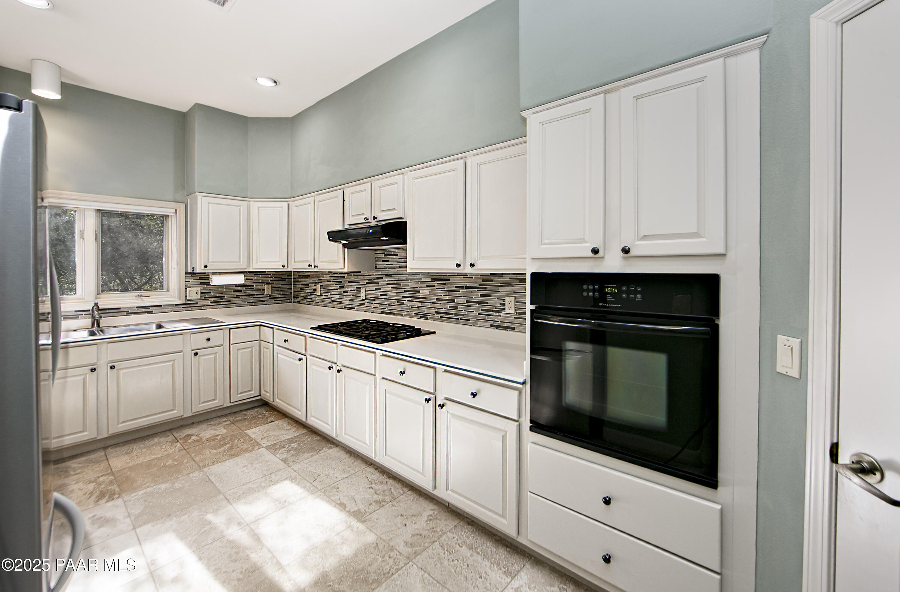 1905 Timber Point West Prescott, AZ 86303 - Photo 5 of 27 a kitchen with granite countertop white cabinets and white appliances