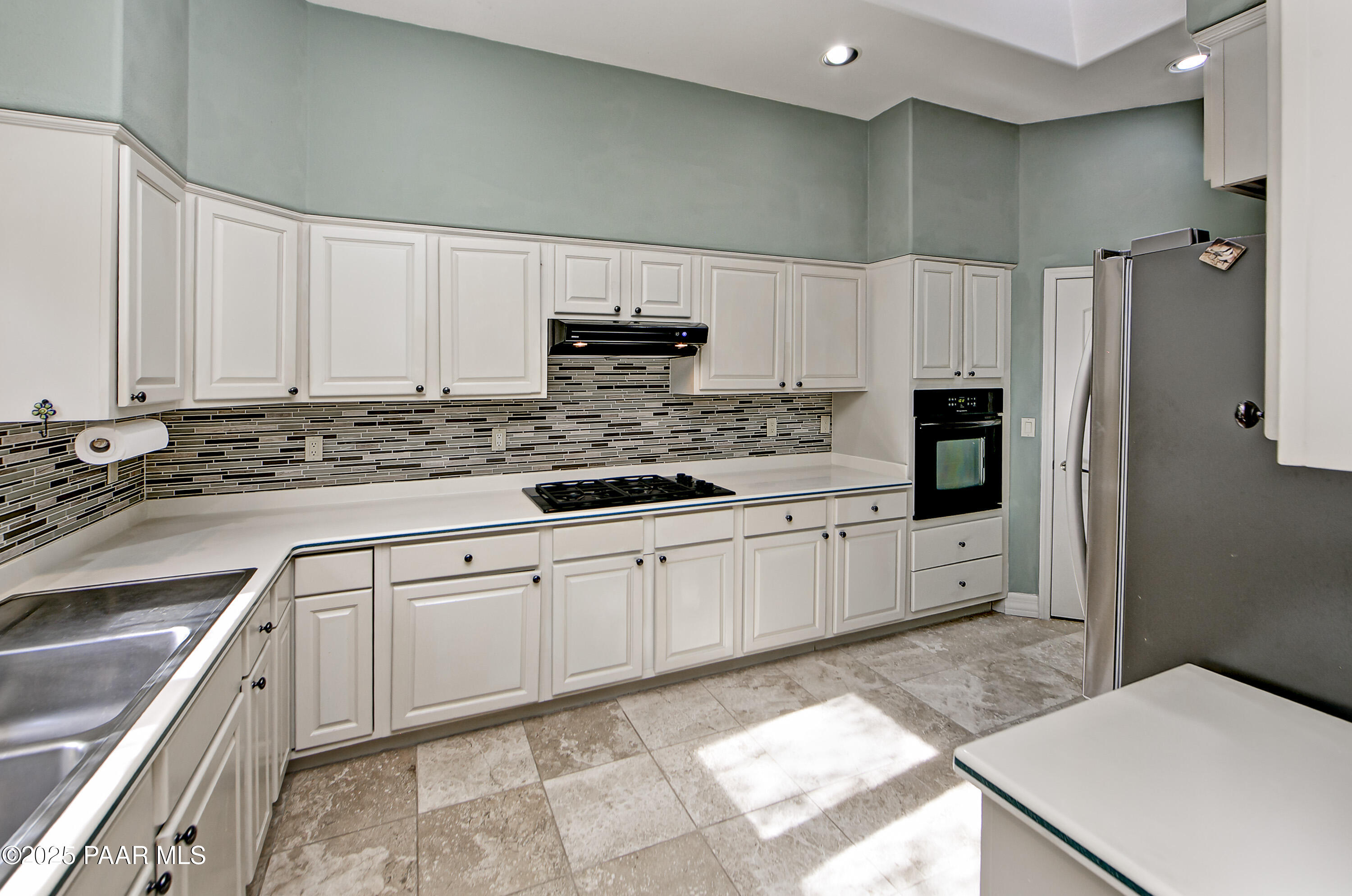 1905 Timber Point West Prescott, AZ 86303 - Photo 6 of 27 a kitchen with stainless steel appliances granite countertop a refrigerator sink and cabinets