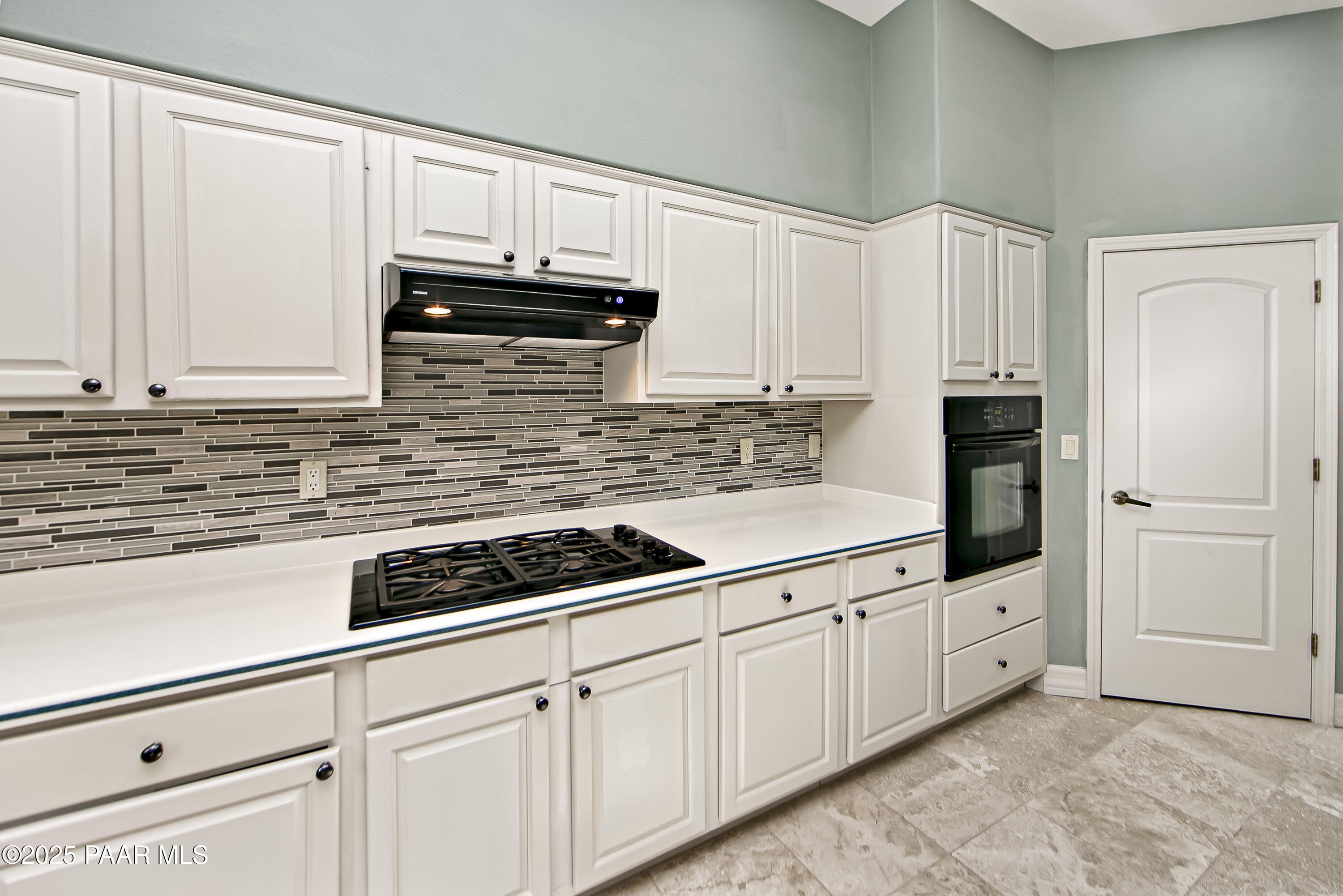 1905 Timber Point West Prescott, AZ 86303 - Photo 7 of 27 a kitchen with white cabinets and white appliances