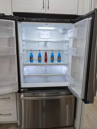 a close view of sink and cabinets