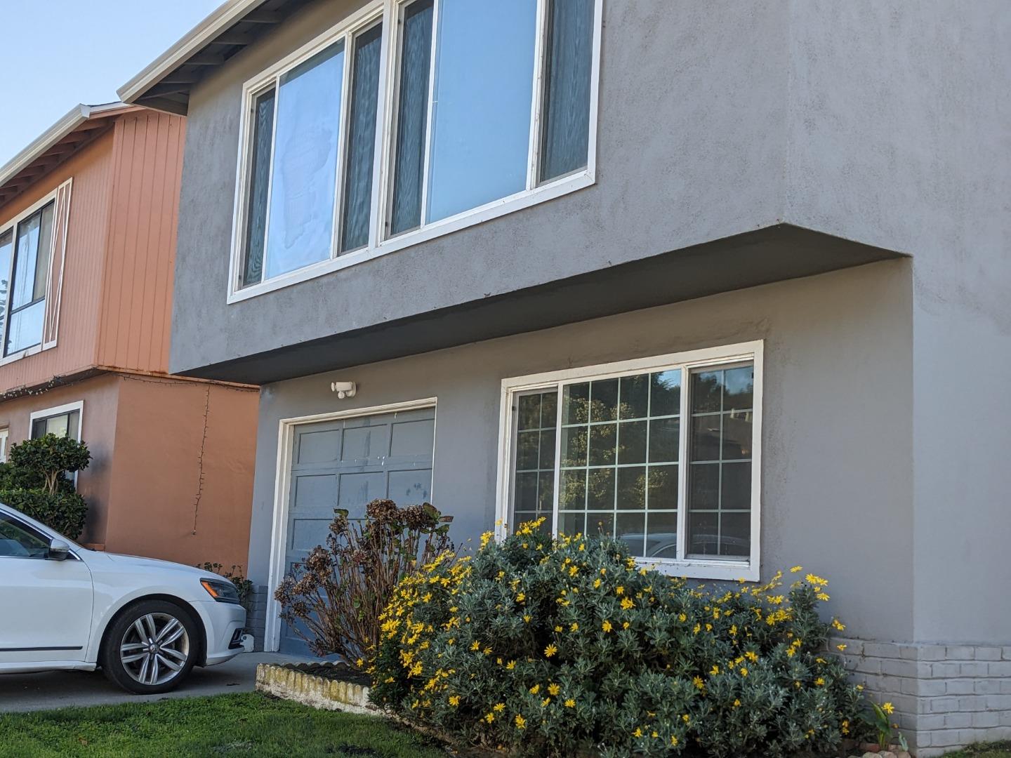 210 Springdale Drive Pacifica, CA 94044 - Photo 2 of 17 a view of a house with a yard and plants