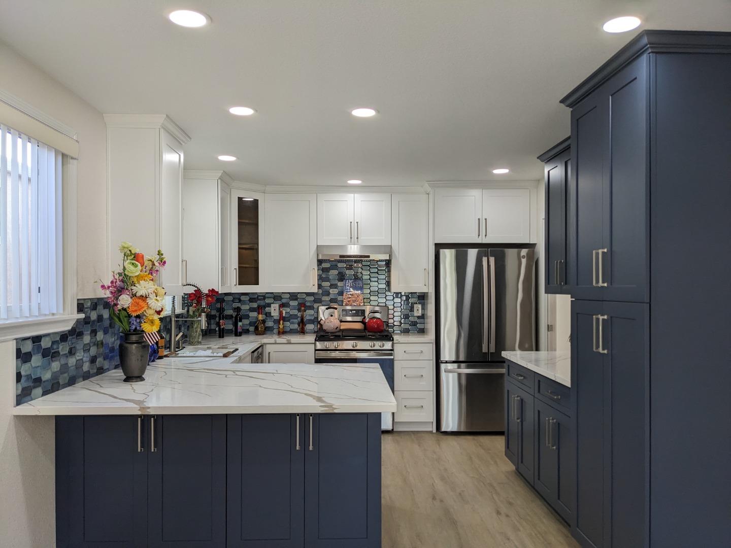 210 Springdale Drive Pacifica, CA 94044 - Photo 6 of 17 a kitchen with refrigerator and cabinets