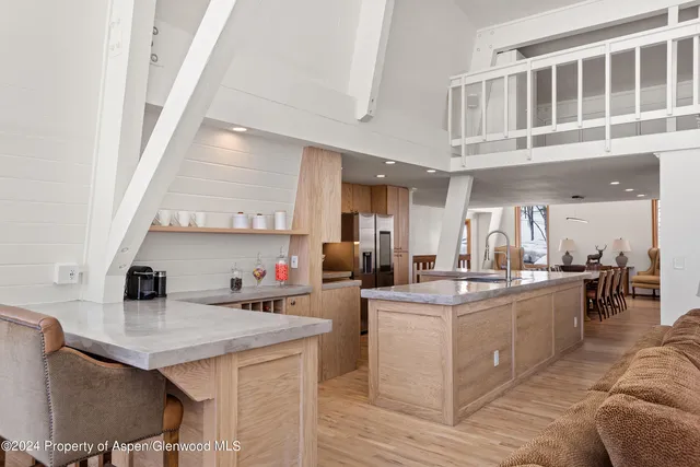 a kitchen with a sink and a stove