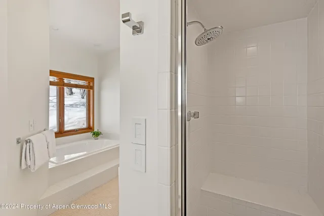 a bathroom with a sink and a large mirror