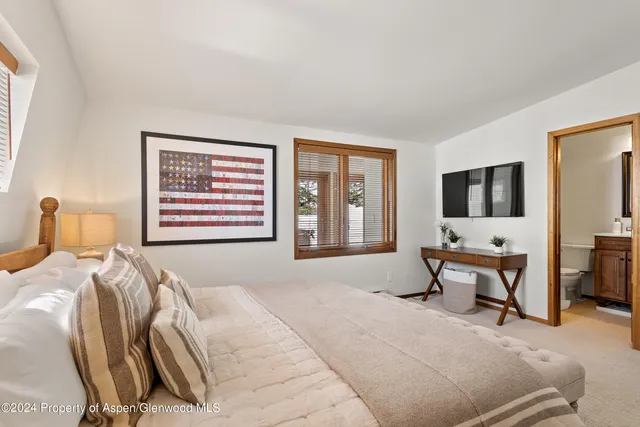 a bathroom with a sink double vanity and a mirror