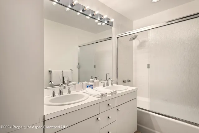 a spacious bedroom with a bed and a window