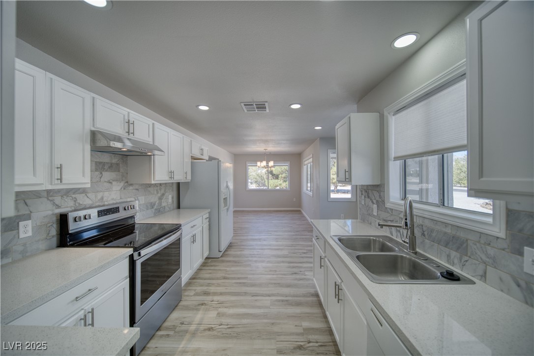 561 Jarvis Road Pahrump, NV 89060 - Photo 14 of 64 New recessed ceiling lighting in full on position. The next image shows the backlit/night light mode.
