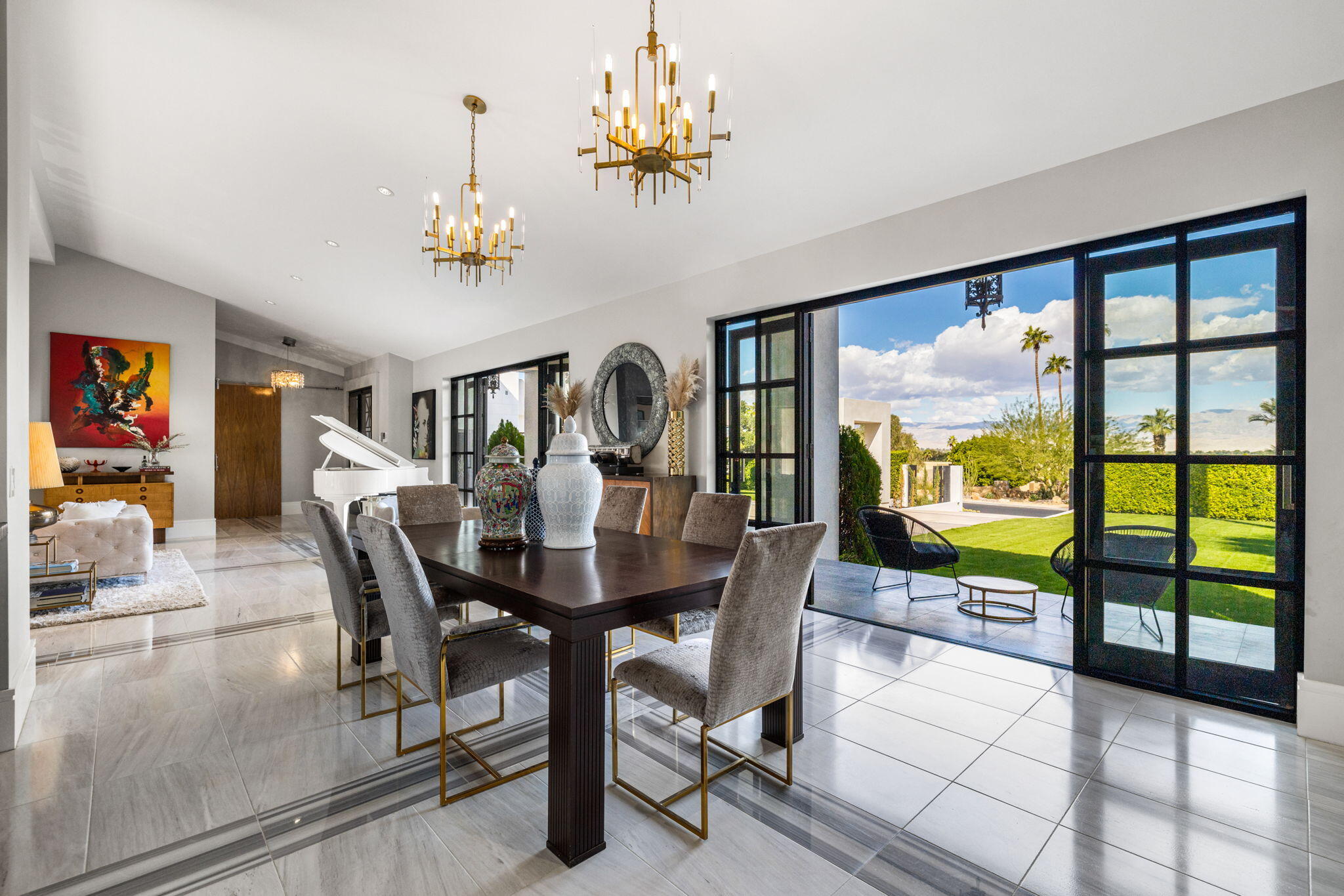 70481 Placerville Road Rancho Mirage, CA 92270 - Photo 12 of 42 a view of a dining room with furniture a chandelier and large windows