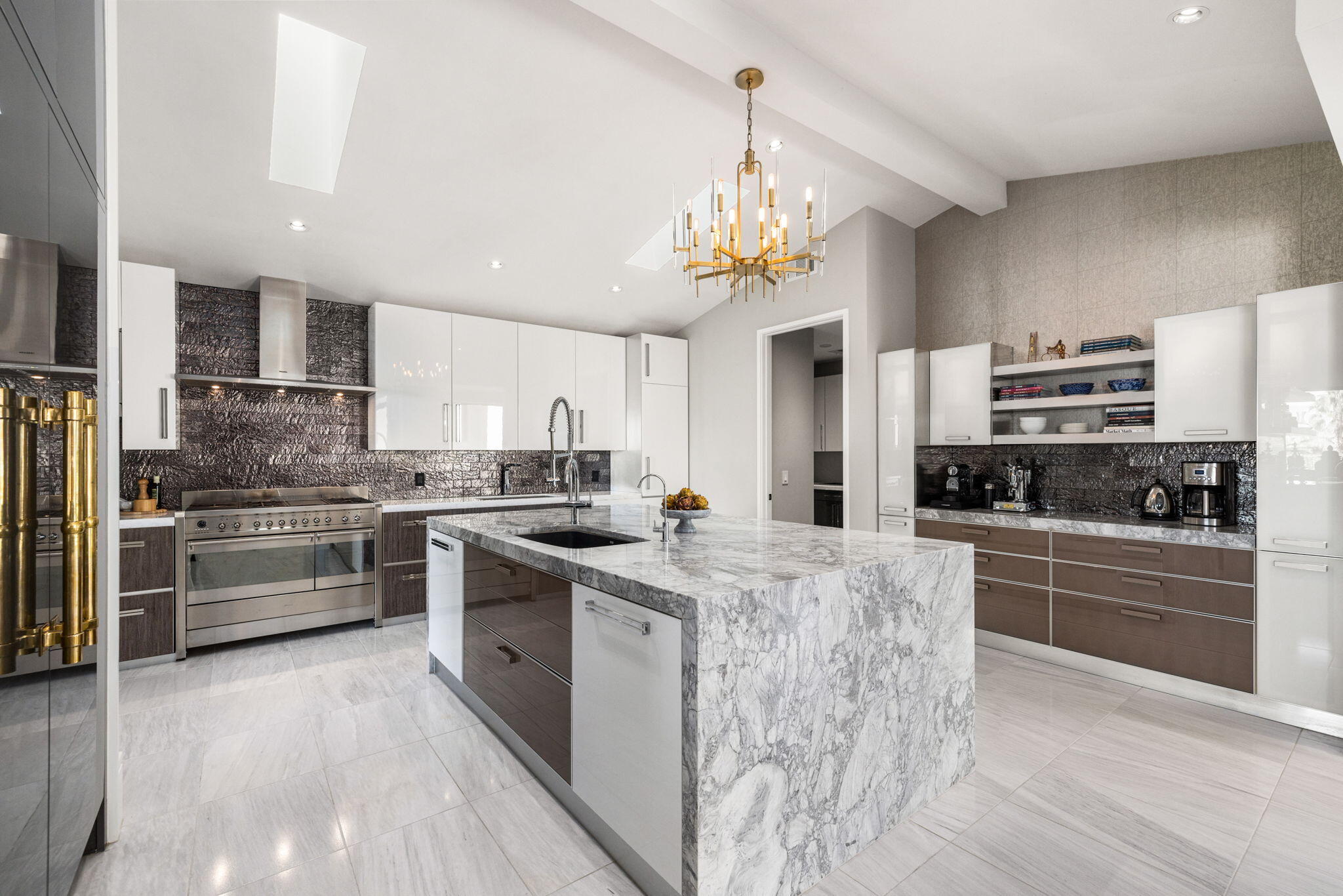 70481 Placerville Road Rancho Mirage, CA 92270 - Photo 14 of 42 a kitchen with stainless steel appliances a stove top oven a sink dishwasher and a refrigerator