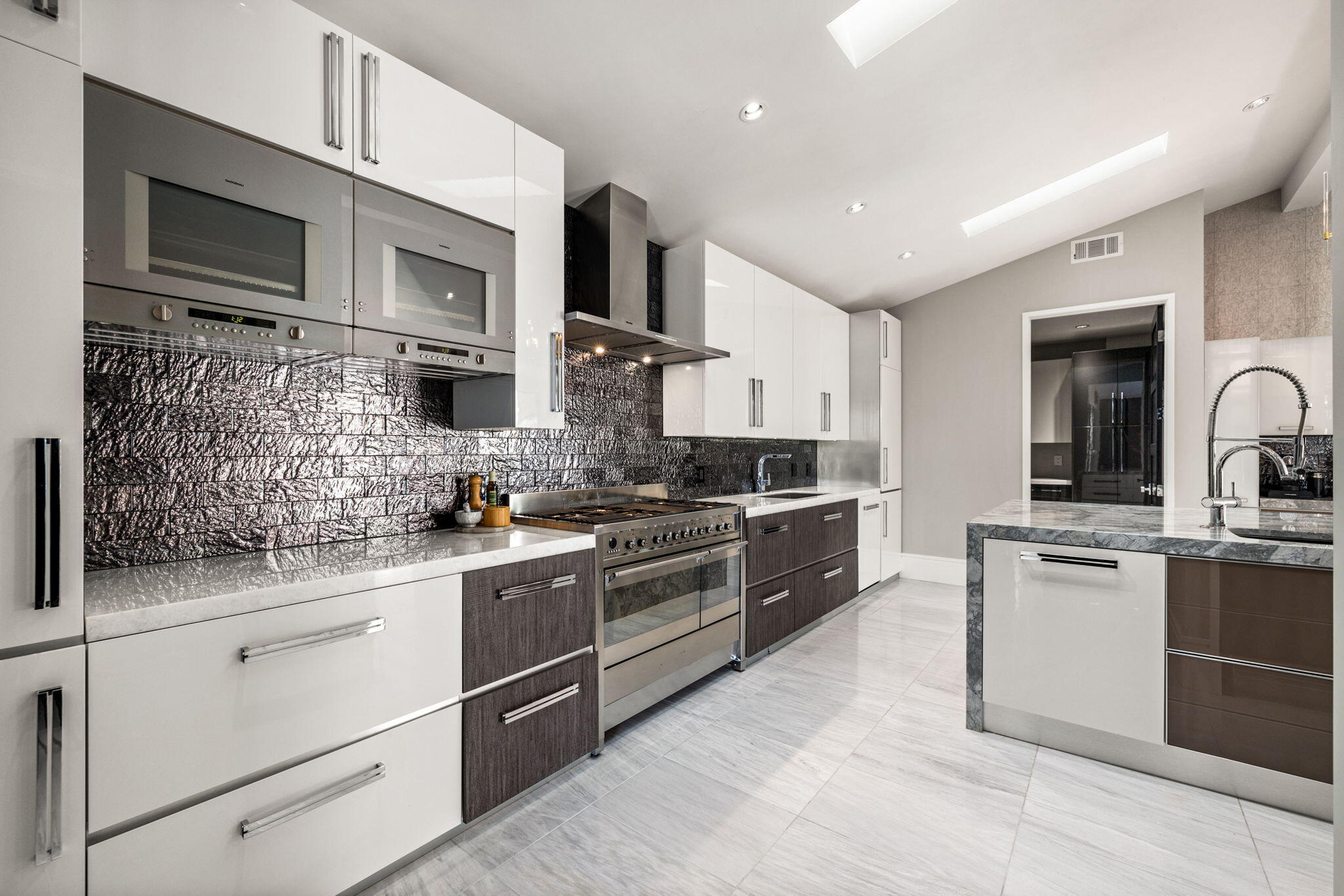 70481 Placerville Road Rancho Mirage, CA 92270 - Photo 15 of 42 a kitchen with stainless steel appliances granite countertop a sink and stove top oven