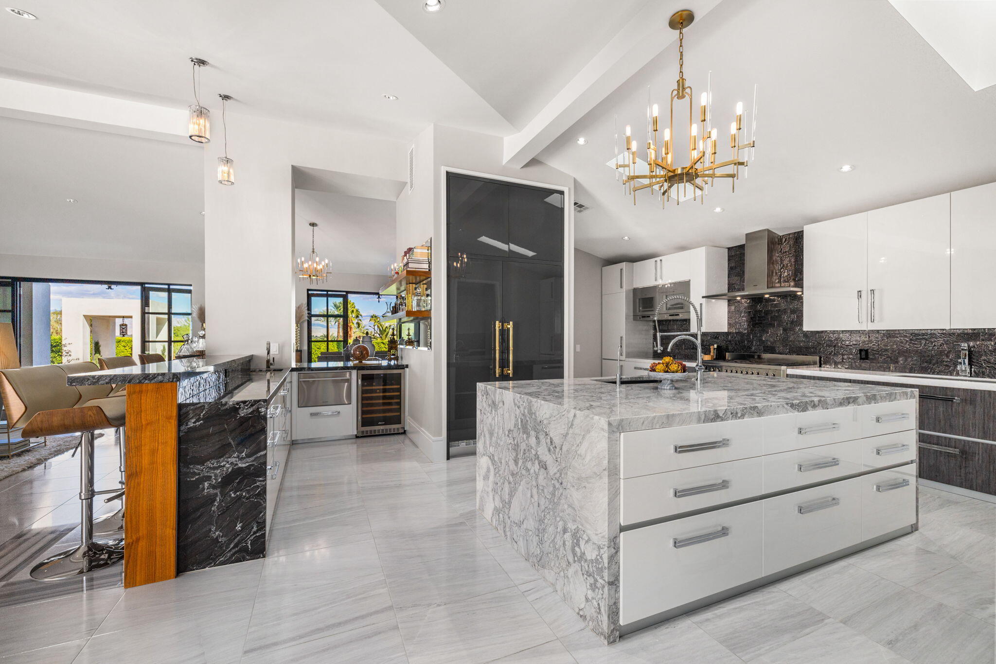 70481 Placerville Road Rancho Mirage, CA 92270 - Photo 17 of 42 a large white kitchen with a large counter space