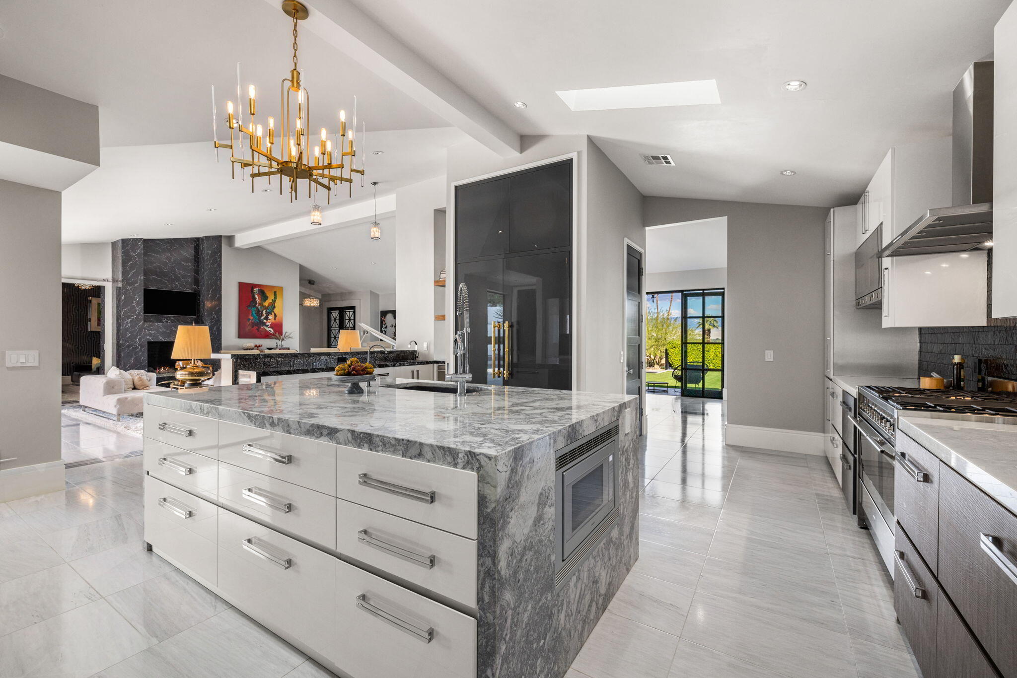 70481 Placerville Road Rancho Mirage, CA 92270 - Photo 18 of 42 a large kitchen with a counter space a sink and stainless steel appliances
