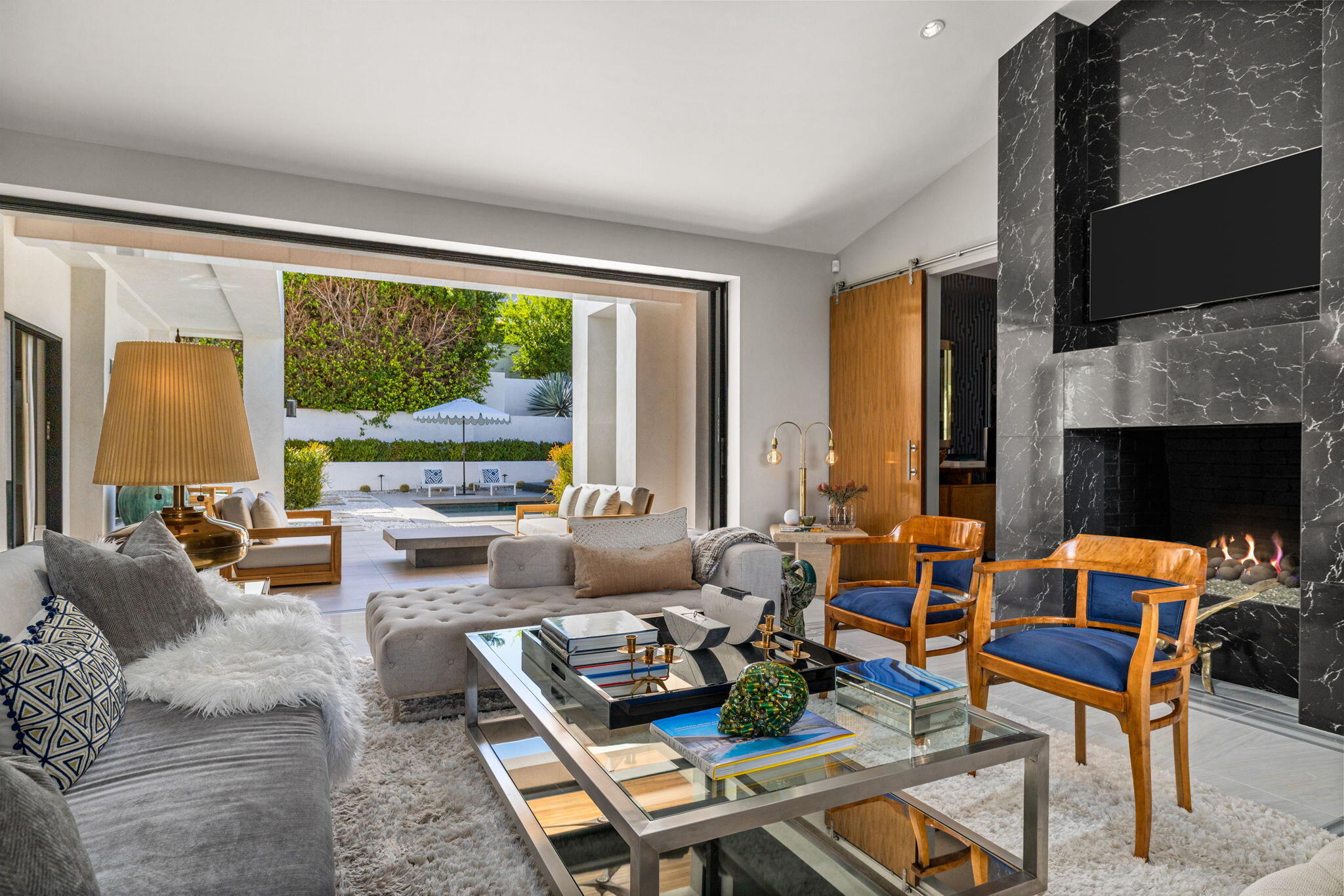 70481 Placerville Road Rancho Mirage, CA 92270 - Photo 19 of 42 a living room with furniture fireplace and a large window