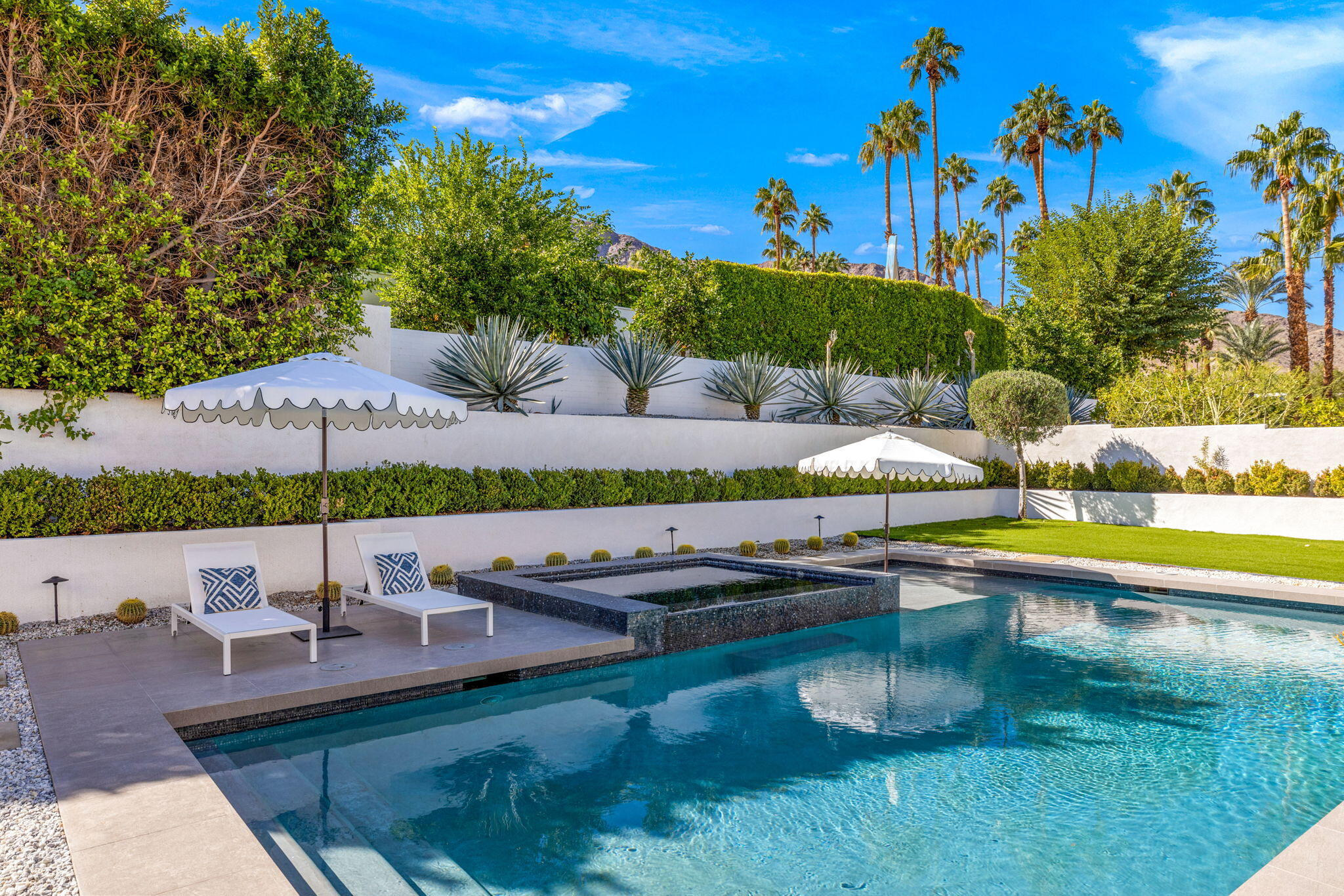70481 Placerville Road Rancho Mirage, CA 92270 - Photo 24 of 42 a view of a swimming pool and lounge chairs