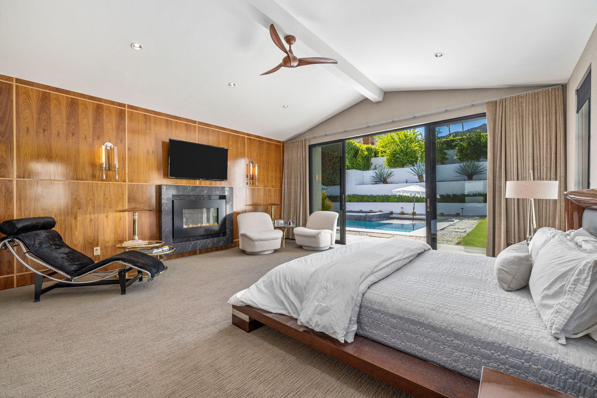 70481 Placerville Road Rancho Mirage, CA 92270 - Photo 26 of 42 a bedroom with a bed a flat screen tv and balcony