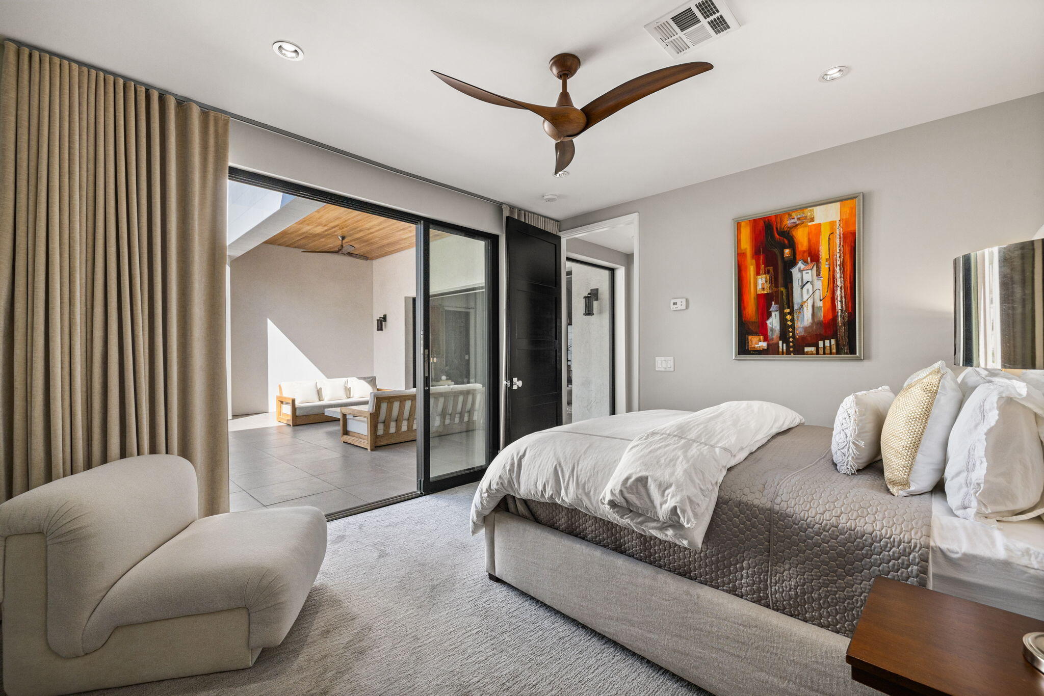 70481 Placerville Road Rancho Mirage, CA 92270 - Photo 34 of 42 a bedroom with a large bed couch and a window