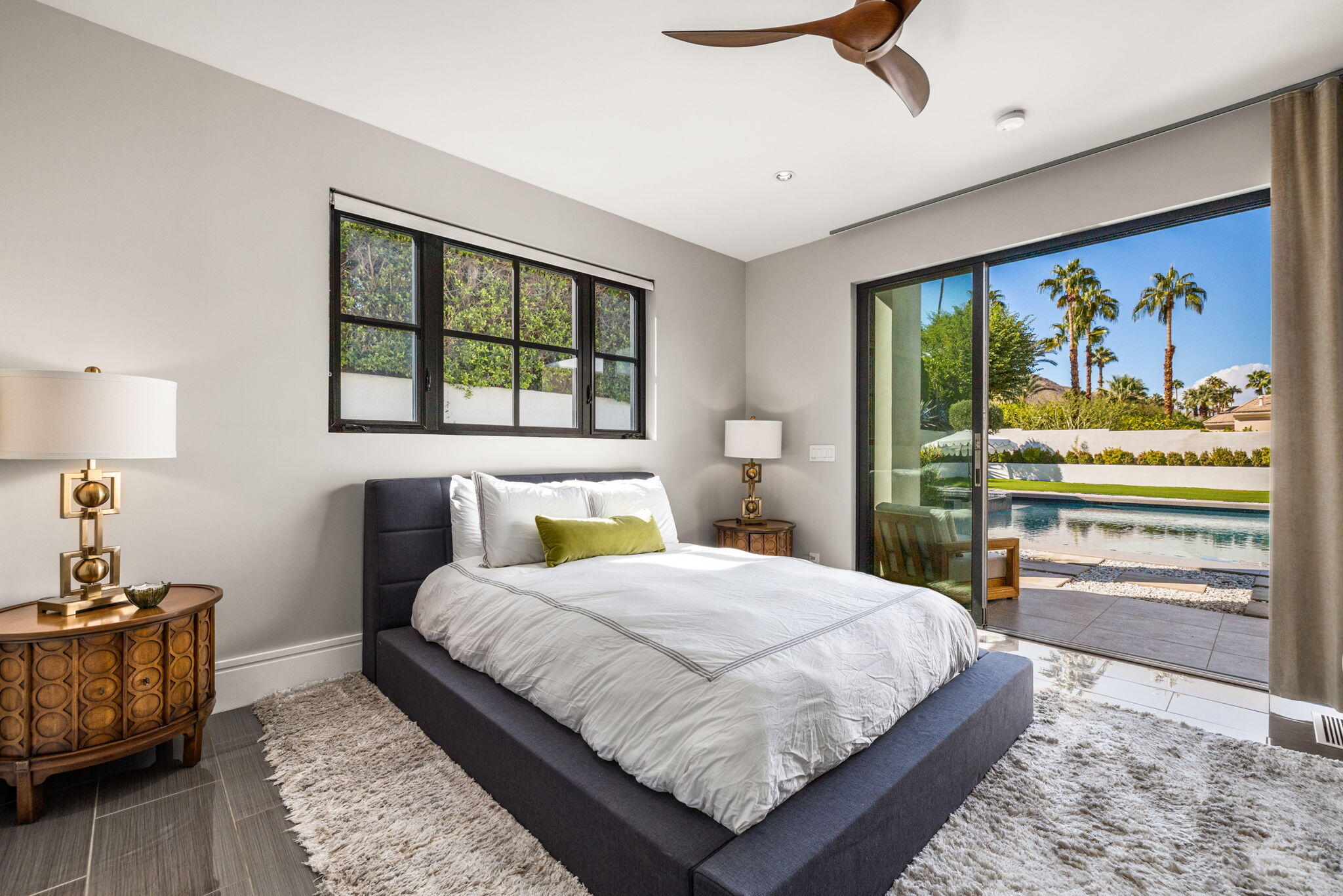 70481 Placerville Road Rancho Mirage, CA 92270 - Photo 38 of 42 a bedroom with a bed and a dresser next to a window