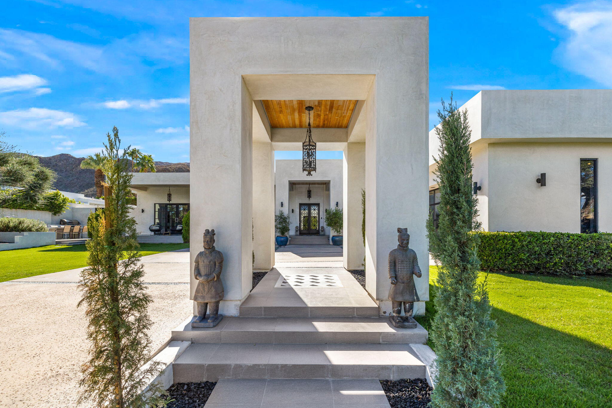 70481 Placerville Road Rancho Mirage, CA 92270 - Photo 5 of 42 a front view of a house with a yard