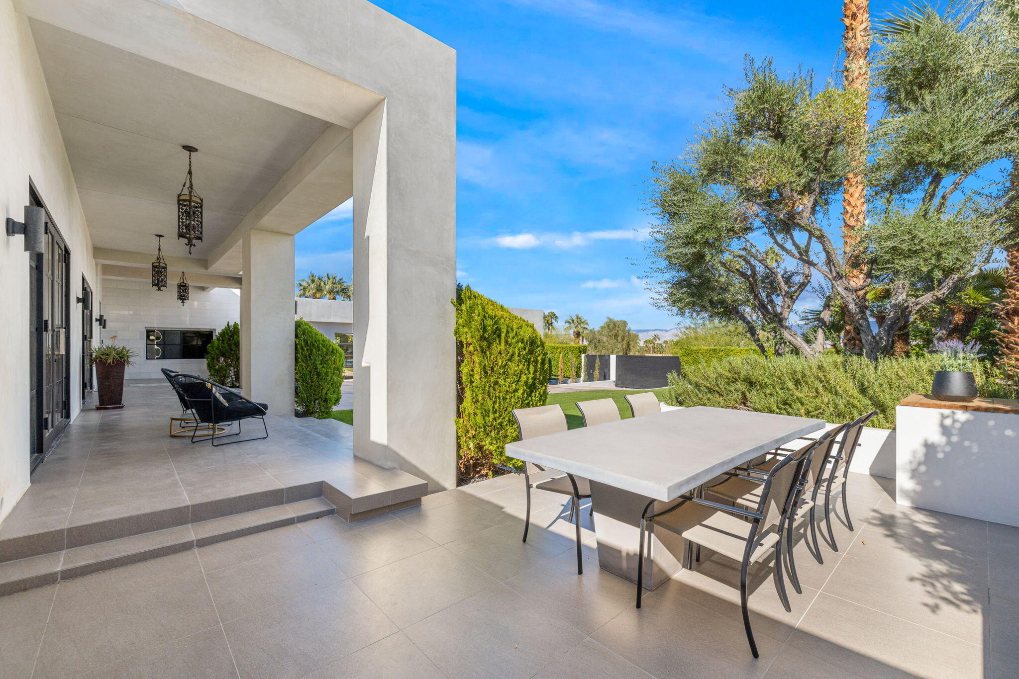 70481 Placerville Road Rancho Mirage, CA 92270 - Photo 9 of 42 a view of a patio with a table and chairs and potted plants