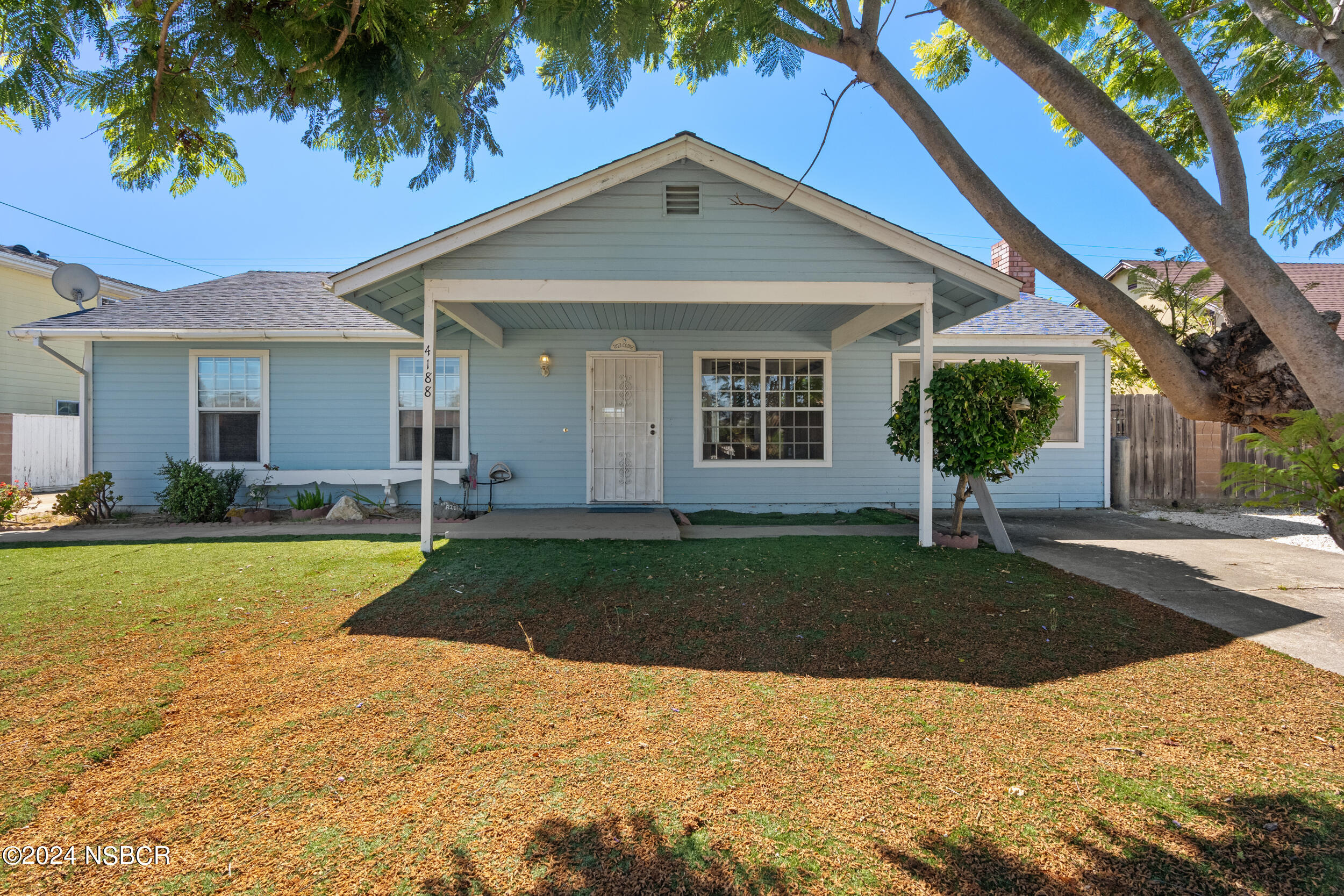 4188 Constellation Road Lompoc, CA 93436 - Photo 1 of 37 a front view of a house with a yard and garage