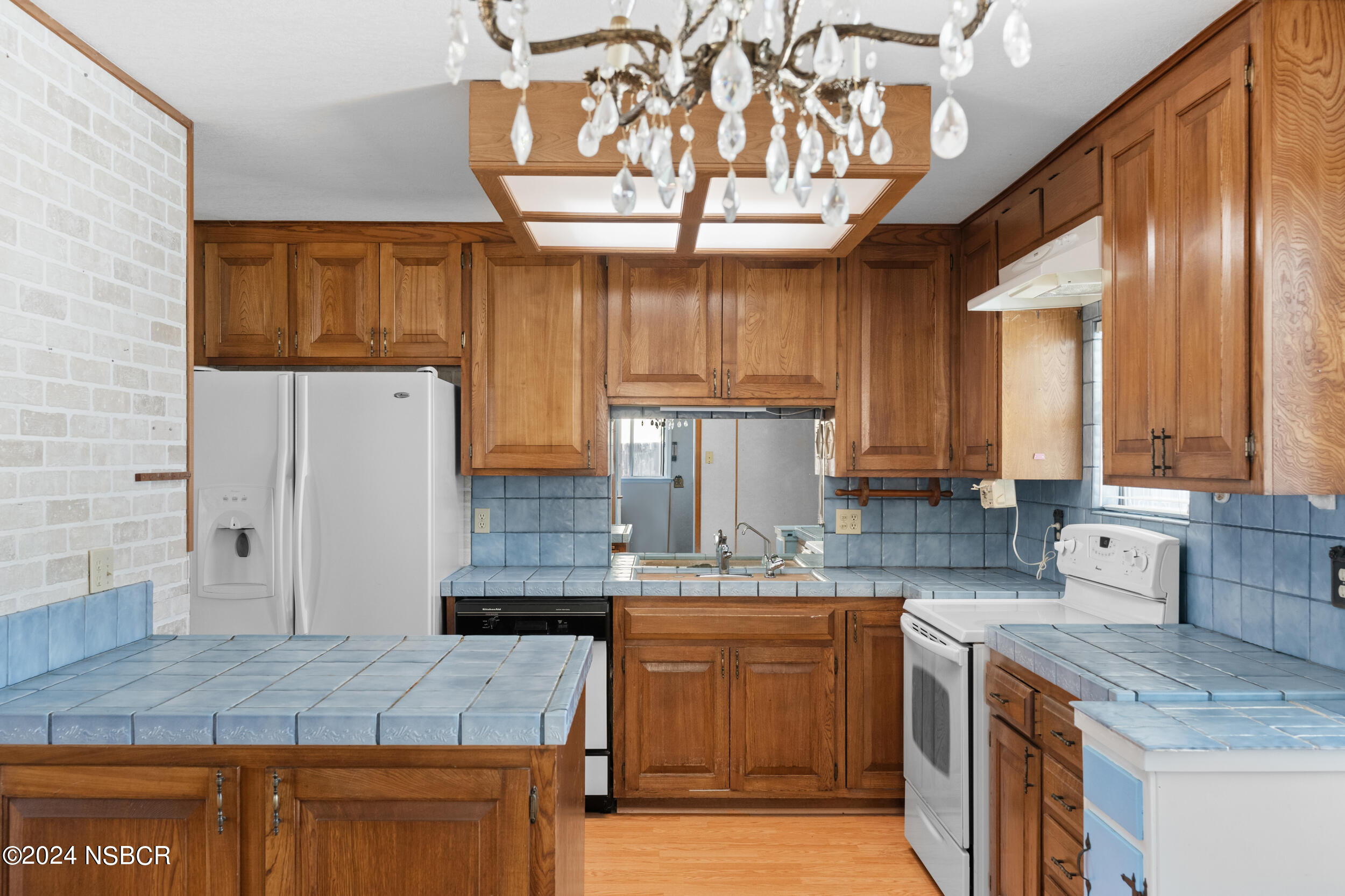 4188 Constellation Road Lompoc, CA 93436 - Photo 11 of 37 a kitchen with stainless steel appliances granite countertop a sink window and cabinets
