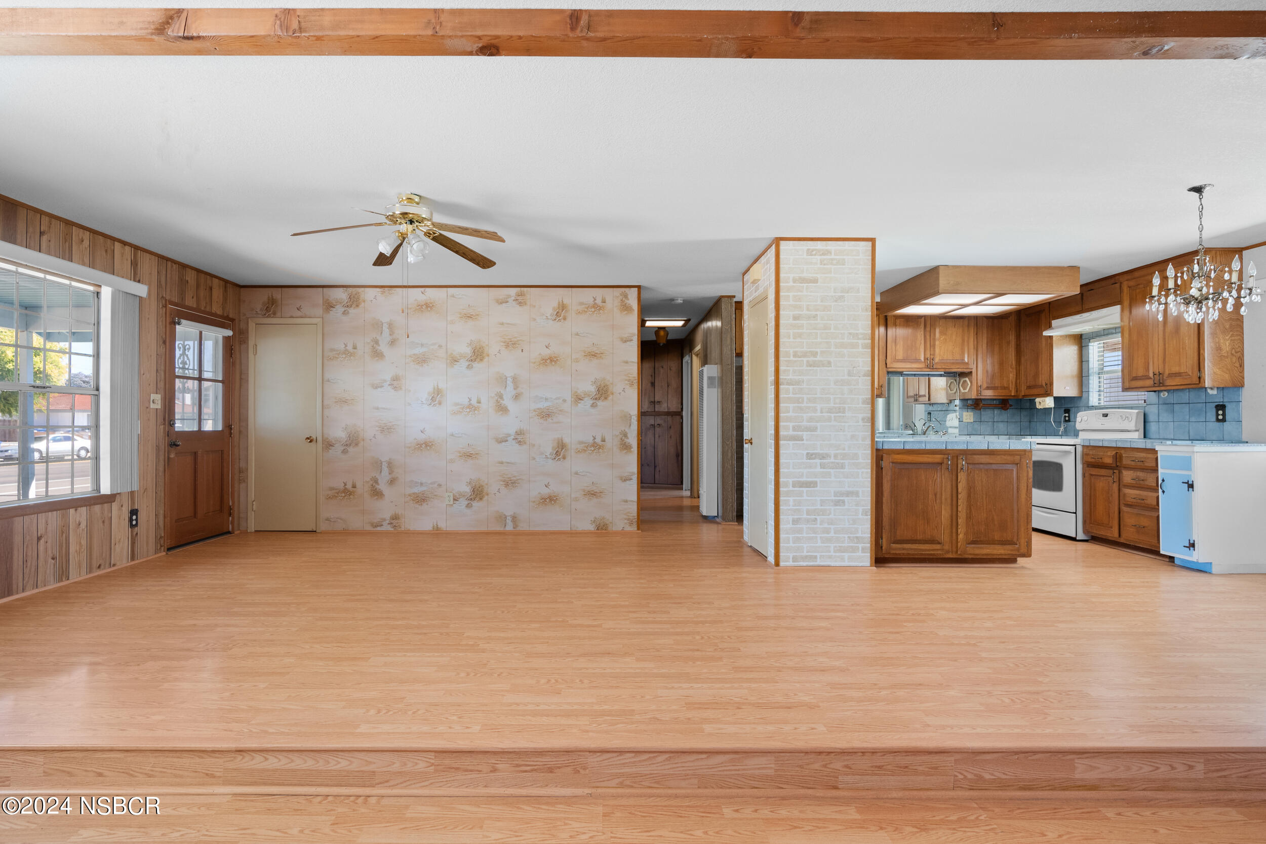 4188 Constellation Road Lompoc, CA 93436 - Photo 12 of 37 a view of a kitchen with refrigerator and cabinets
