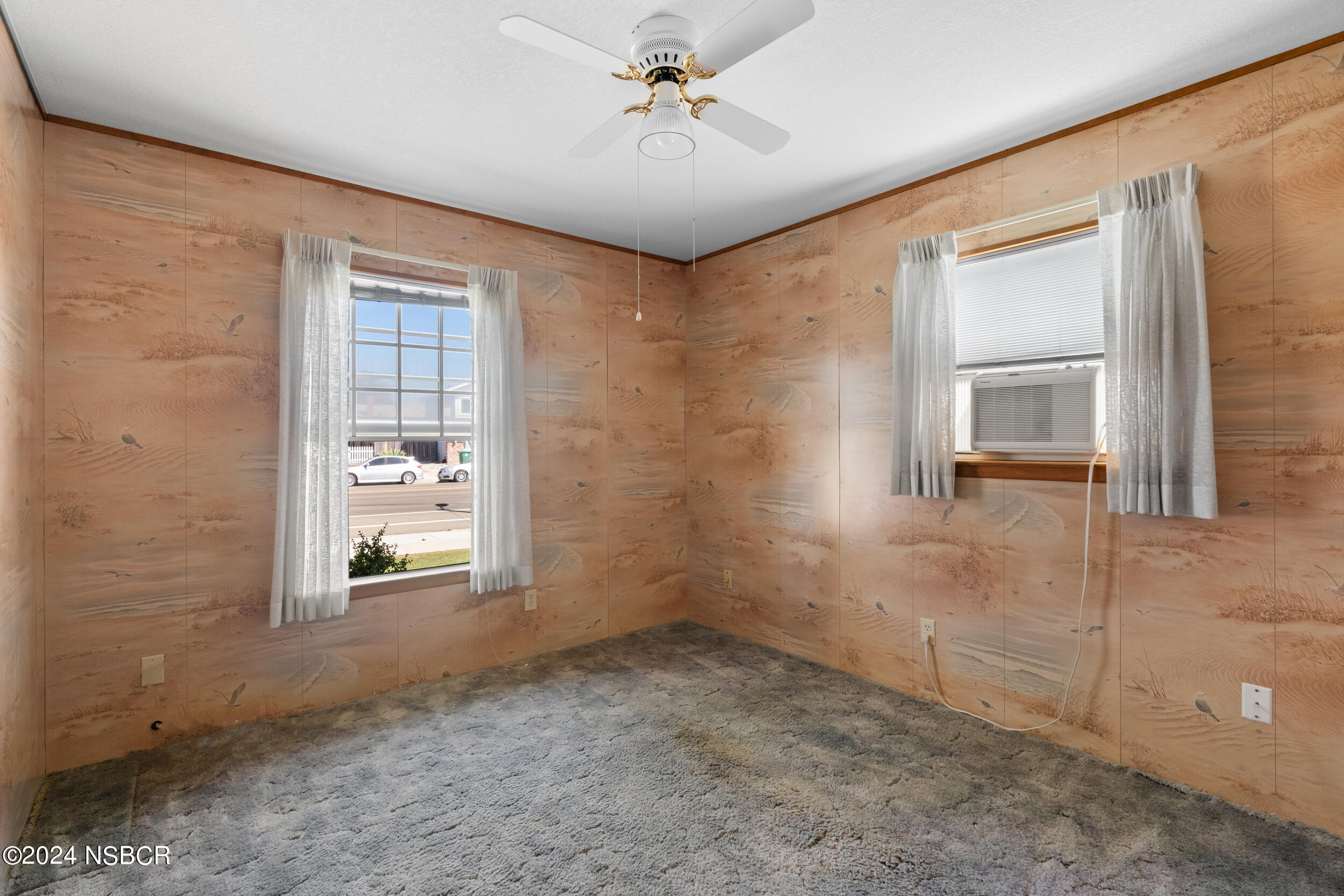 4188 Constellation Road Lompoc, CA 93436 - Photo 17 of 37 an empty room with windows and ceiling fan