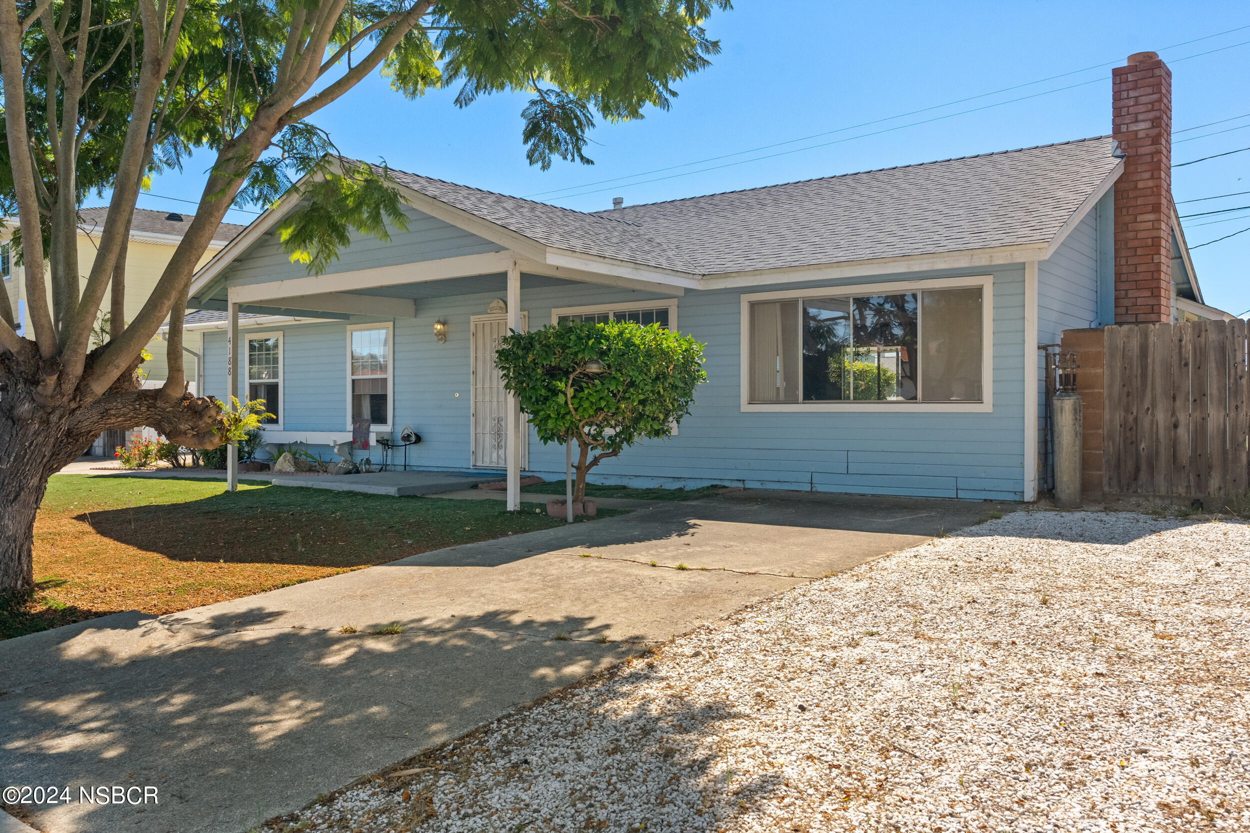 4188 Constellation Road Lompoc, CA 93436 - Photo 2 of 37 a front view of a house with garden