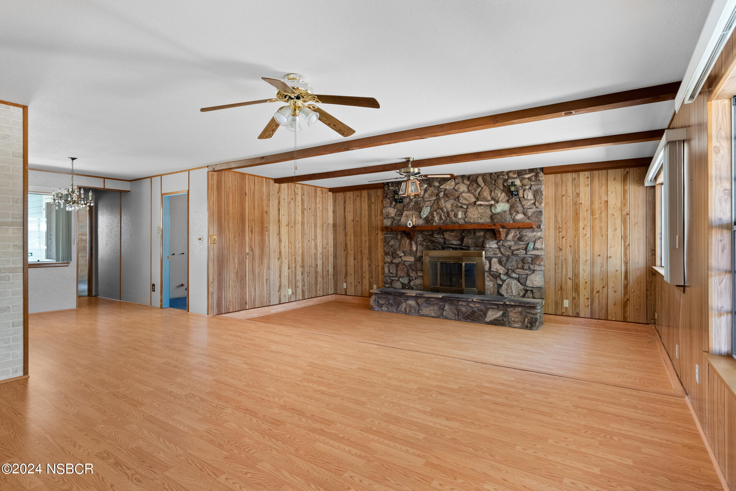 4188 Constellation Road Lompoc, CA 93436 - Photo 4 of 37 a view of empty room with wooden floor and fireplace