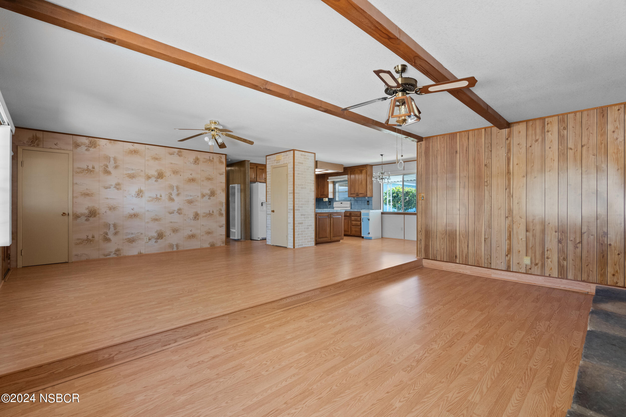 4188 Constellation Road Lompoc, CA 93436 - Photo 6 of 37 a view of empty room with wooden floor and windows