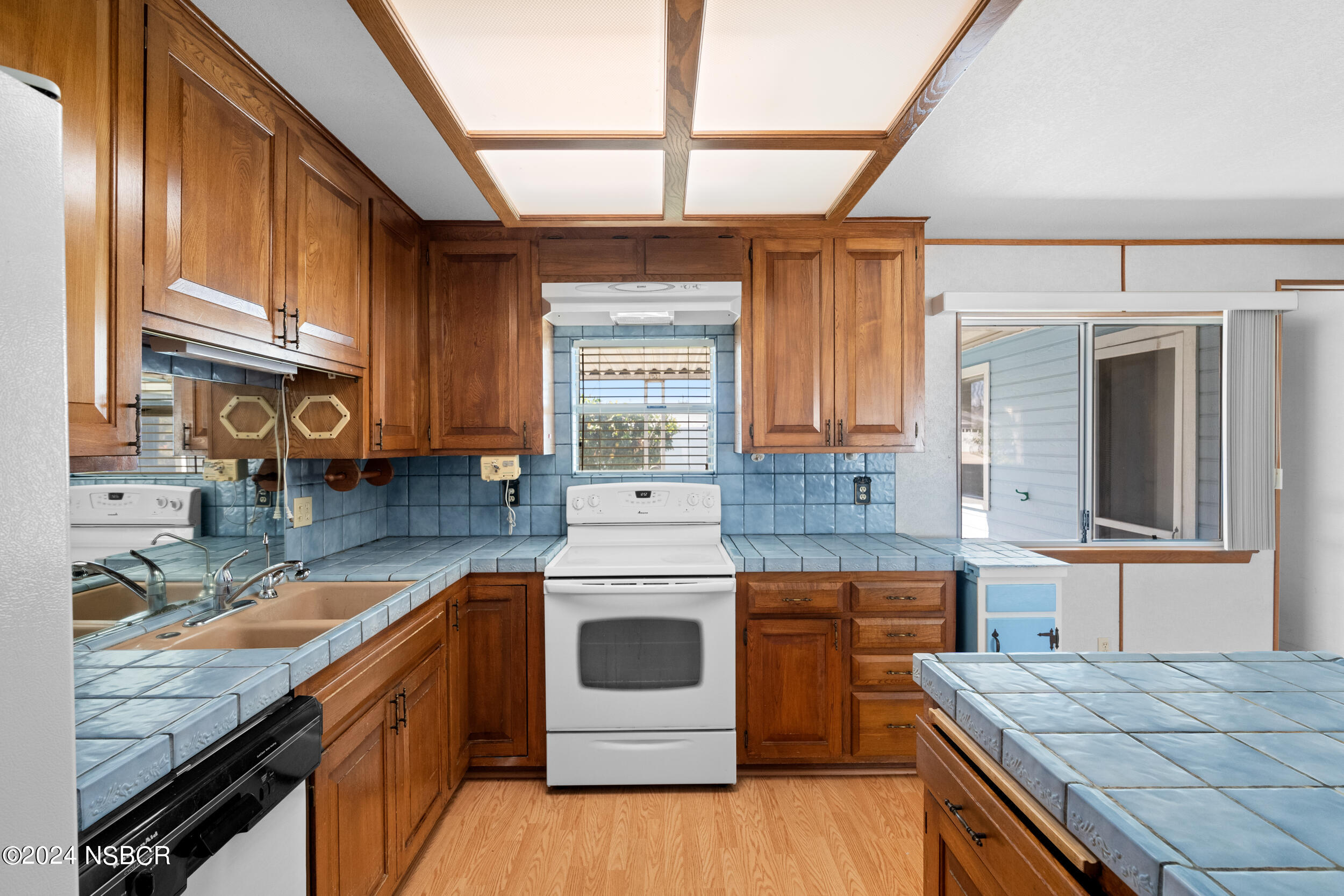 4188 Constellation Road Lompoc, CA 93436 - Photo 9 of 37 a kitchen with a stove and a sink