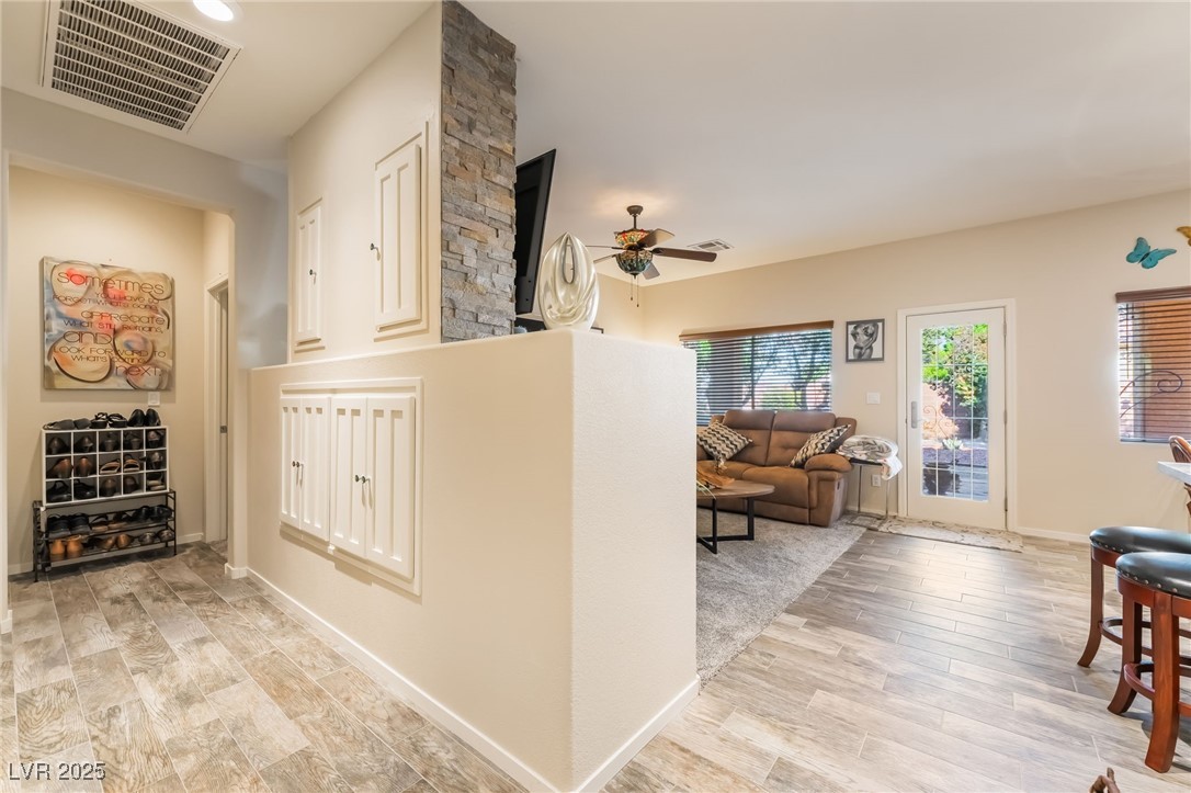 4732 Adriano Way Pahrump, NV 89061 - Photo 11 of 44 Hallway with light wood finished floors and baseboards