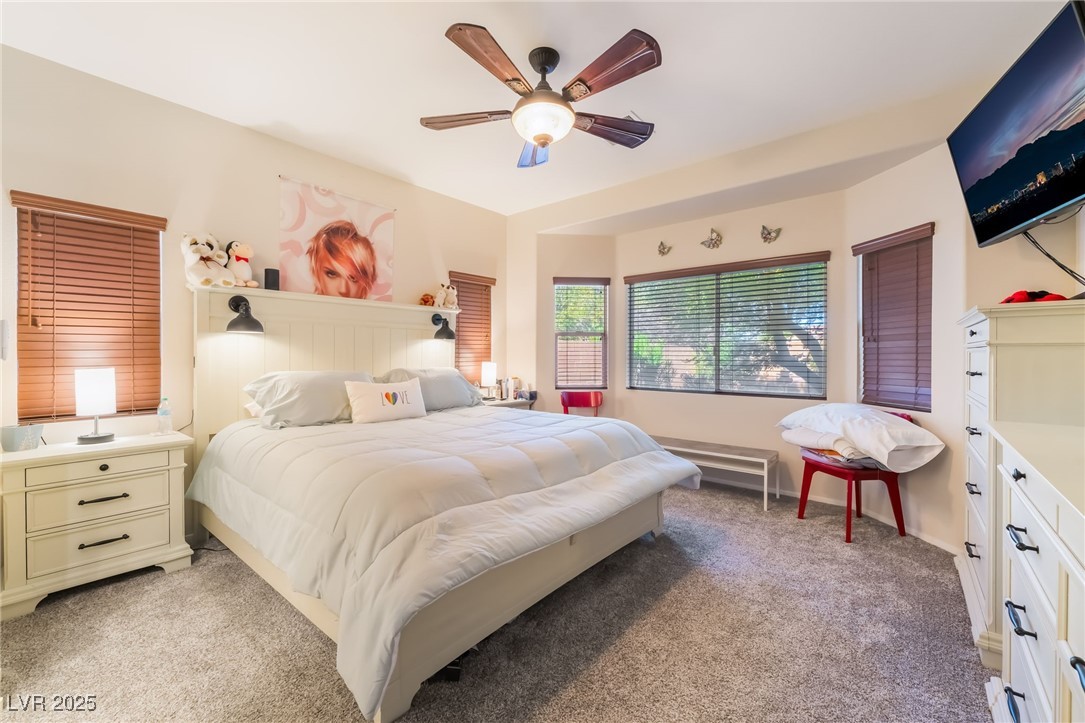4732 Adriano Way Pahrump, NV 89061 - Photo 24 of 44 Bedroom with light carpet and ceiling fan