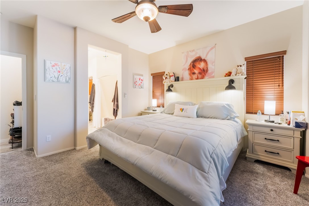 4732 Adriano Way Pahrump, NV 89061 - Photo 25 of 44 Carpeted bedroom featuring a ceiling fan and connected bathroom