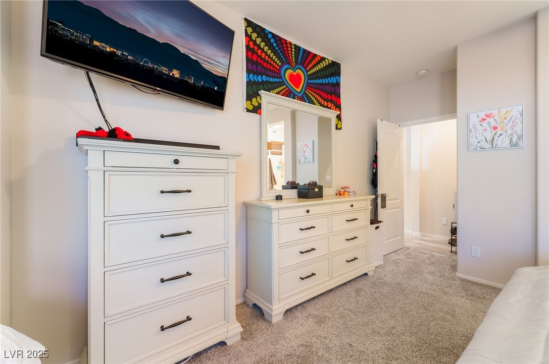 4732 Adriano Way Pahrump, NV 89061 - Photo 26 of 44 Bedroom with light carpet and baseboards