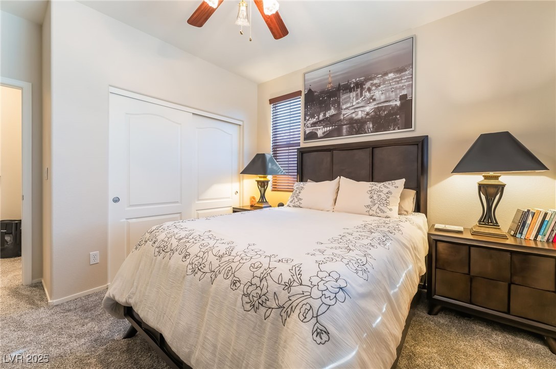 4732 Adriano Way Pahrump, NV 89061 - Photo 32 of 44 Bedroom featuring carpet flooring, a closet, and ceiling fan