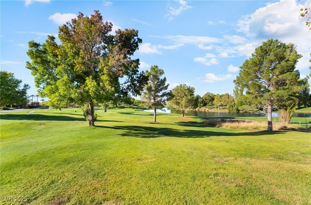 4732 Adriano Way Pahrump, NV 89061 - Photo 43 of 44 View of property's community featuring a lawn, a water view, and view of golf course